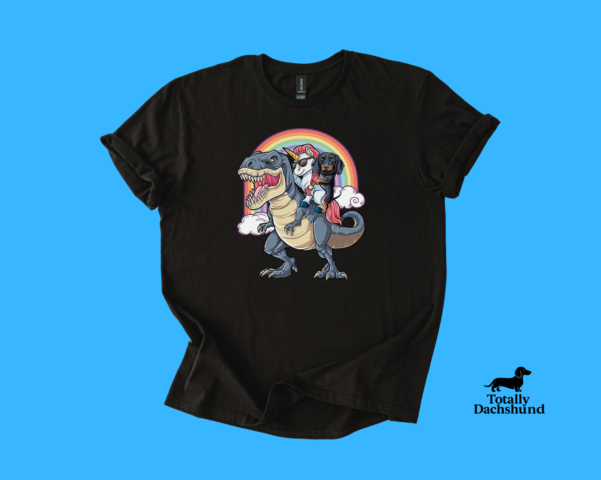 Funny dachshund riding a unicorn with sunglasses on a T-Rex under a rainbow  black novelty dog shirt