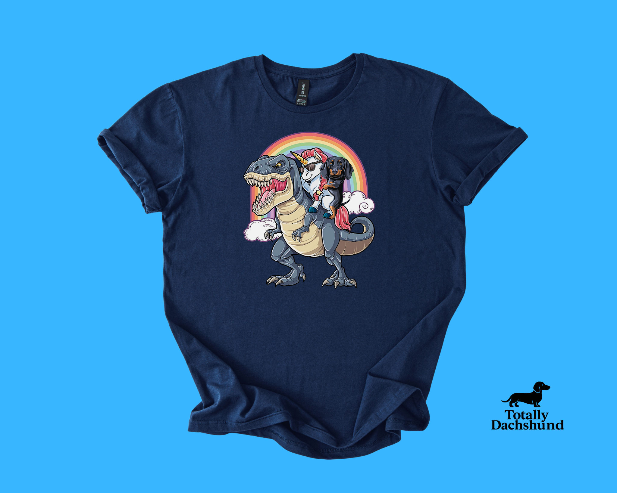 Funny dachshund riding a unicorn with sunglasses on a T-Rex under a rainbow – navy novelty dog shirt