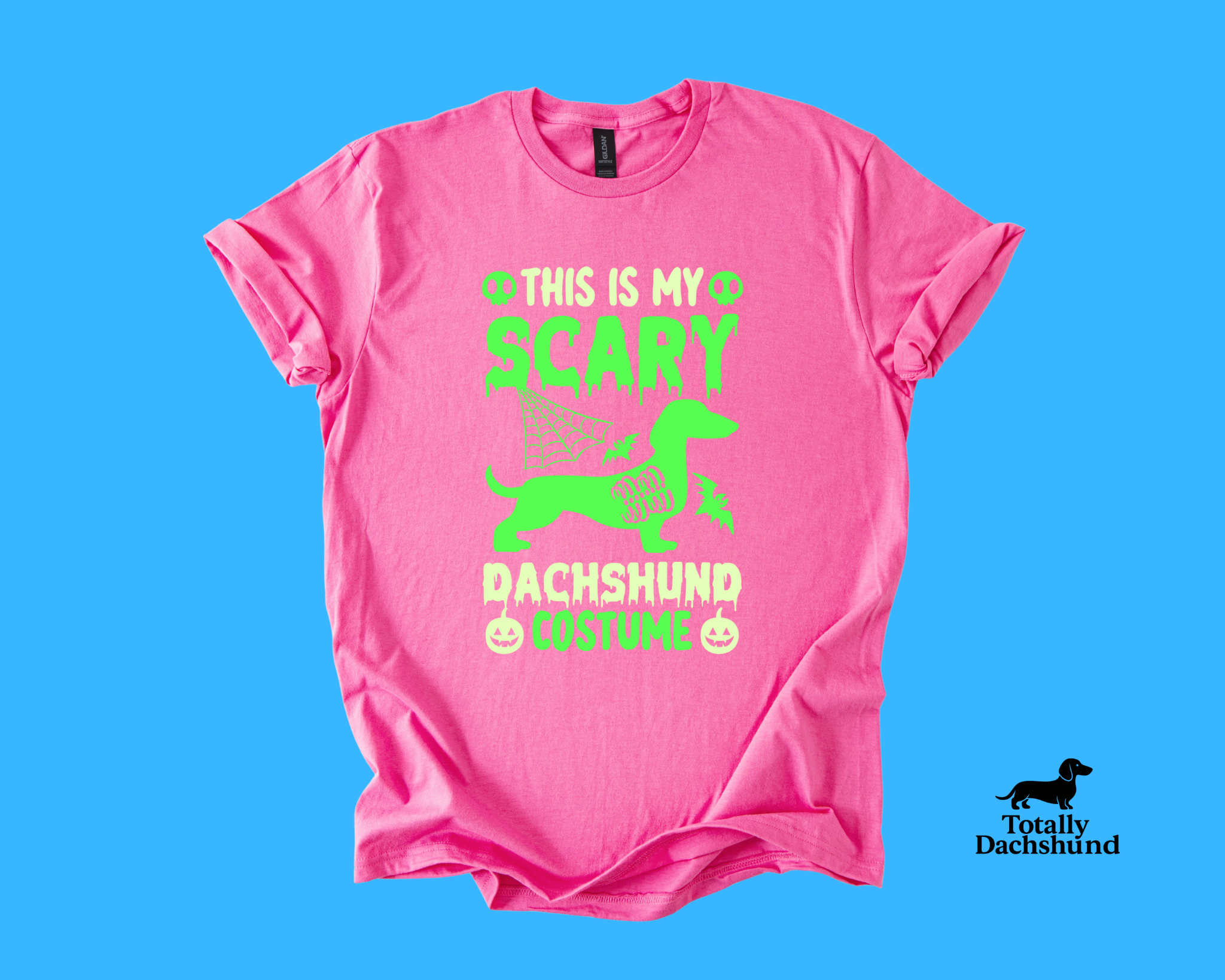pink tee with green dachshund and spooky design