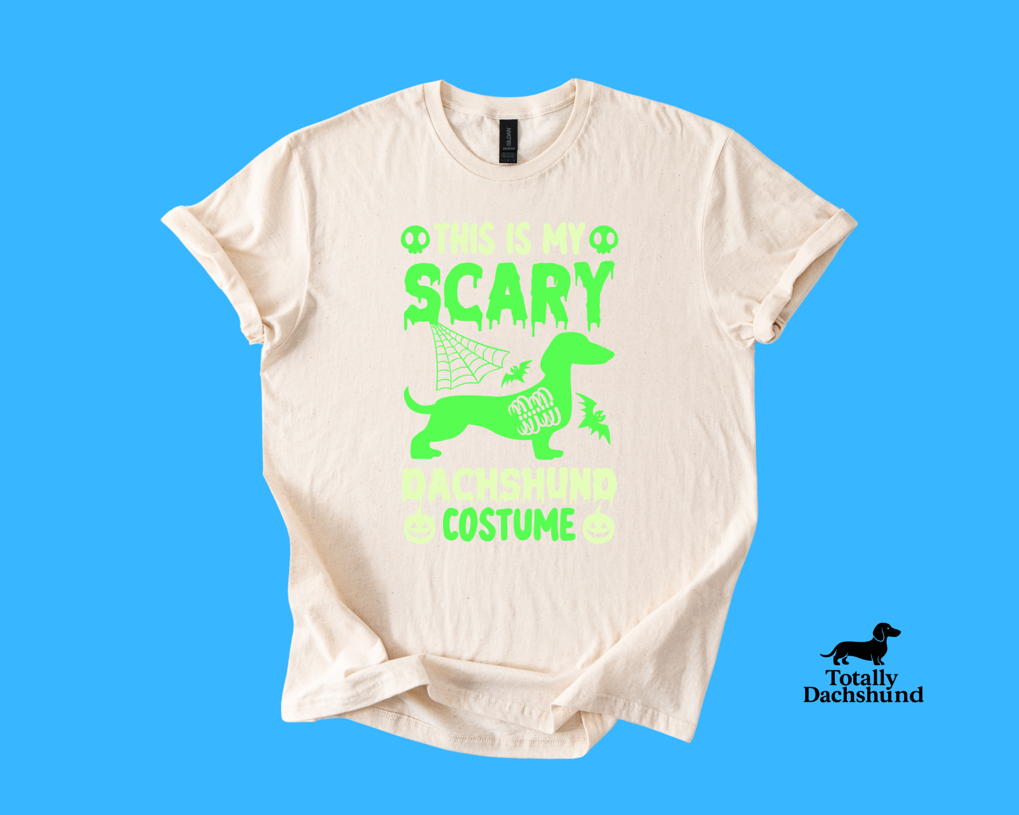 white tee with green dachshund and spooky design